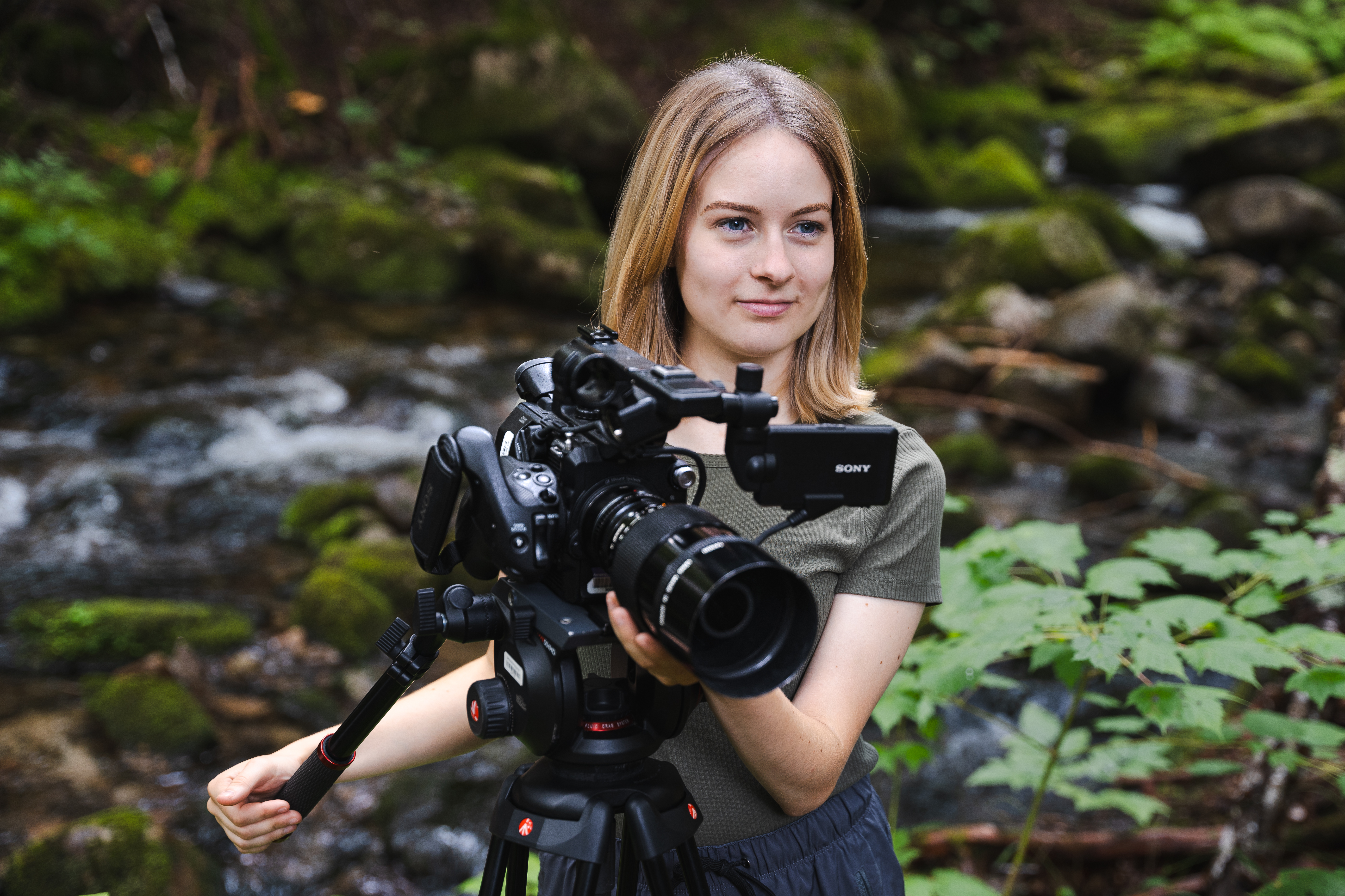 1.	Posing with a camera at the Katahdin Woods and Waters National Monument in Northern Maine