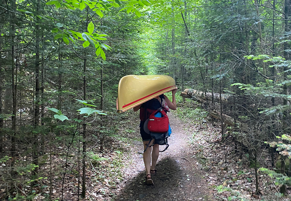 Megan Phillips Carryying into Moose Ponds